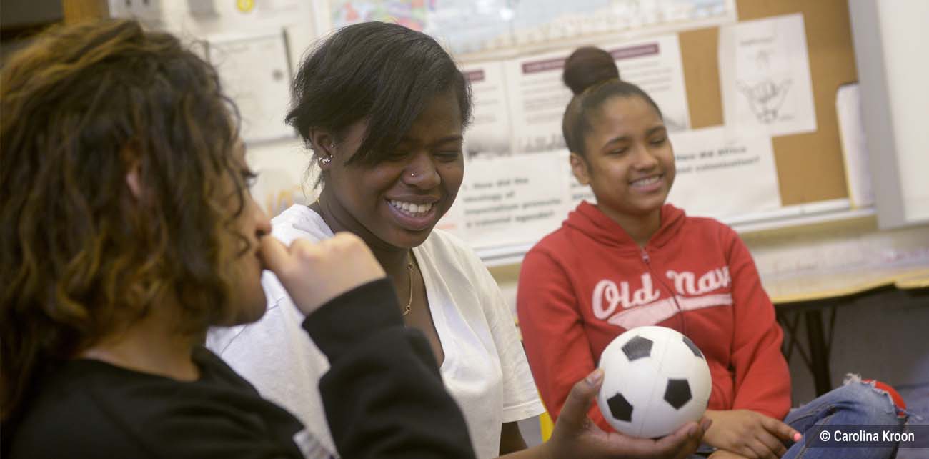 Three girls participating in a circle