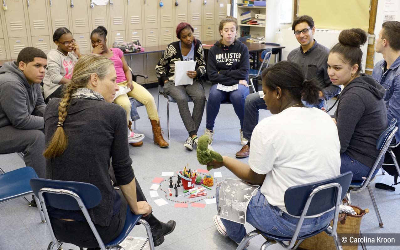 Students participating in a circle