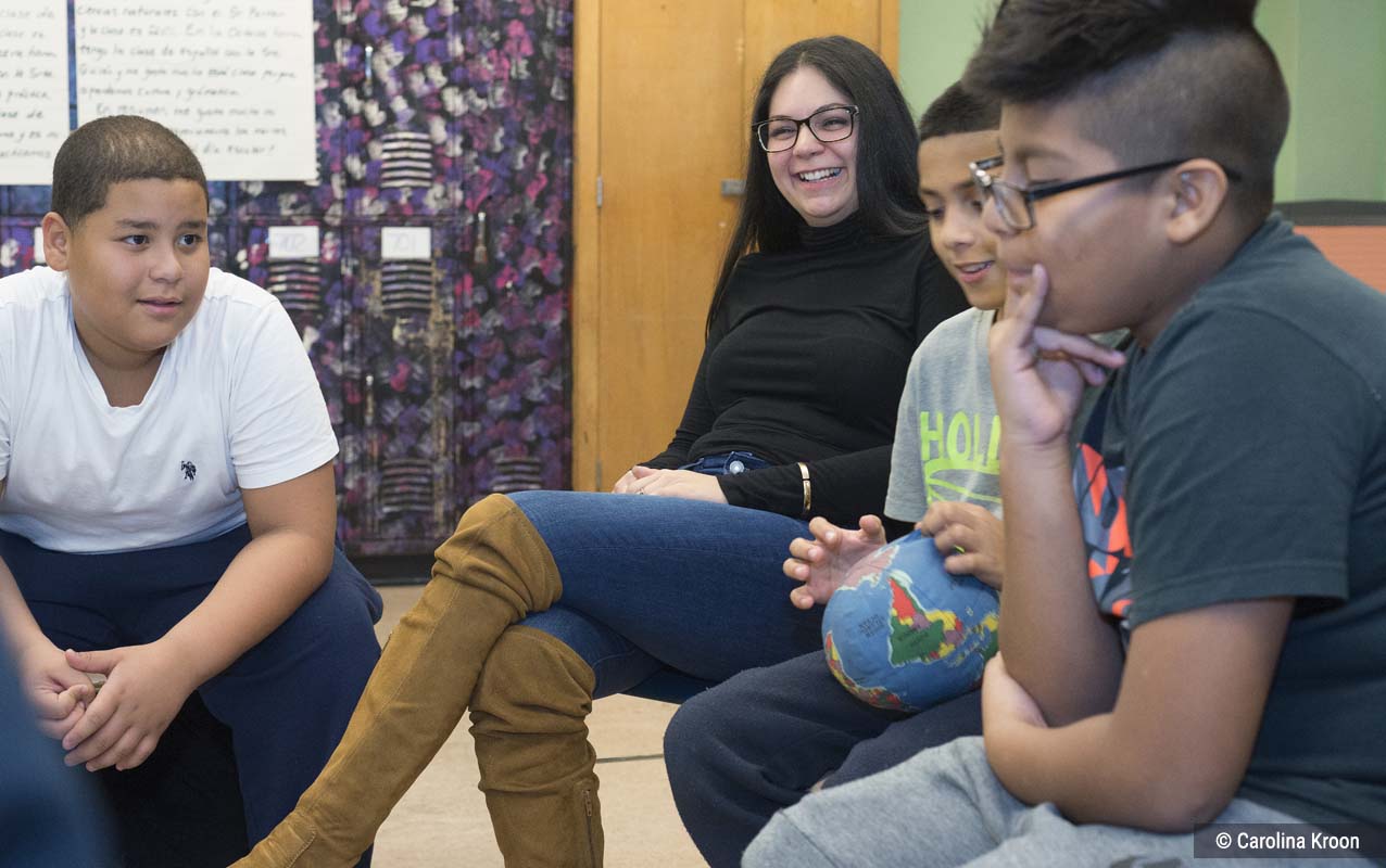 Bryanna facilitating a circle of middle school students