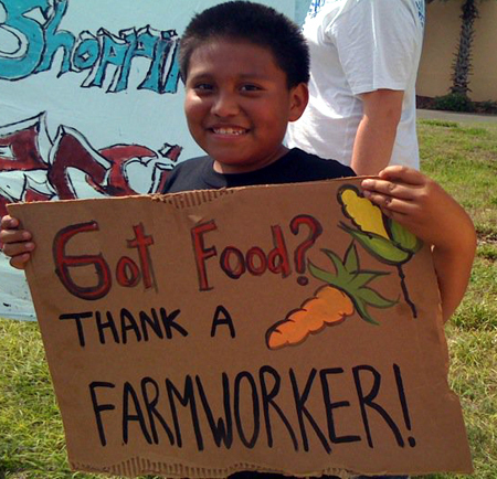 A child holding a sign