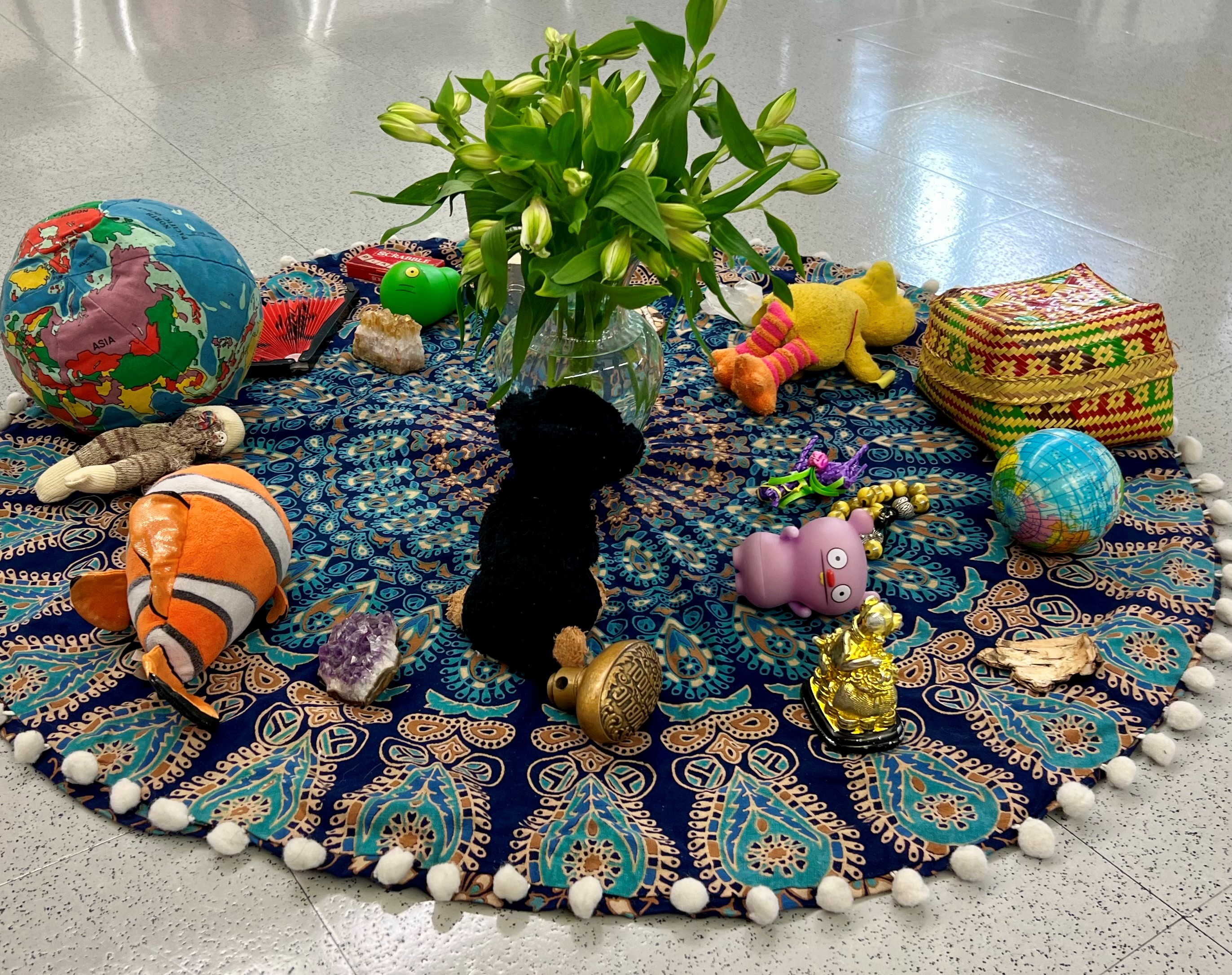 a center piece with toys, flowers, and more