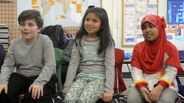 Three students participating in a circle