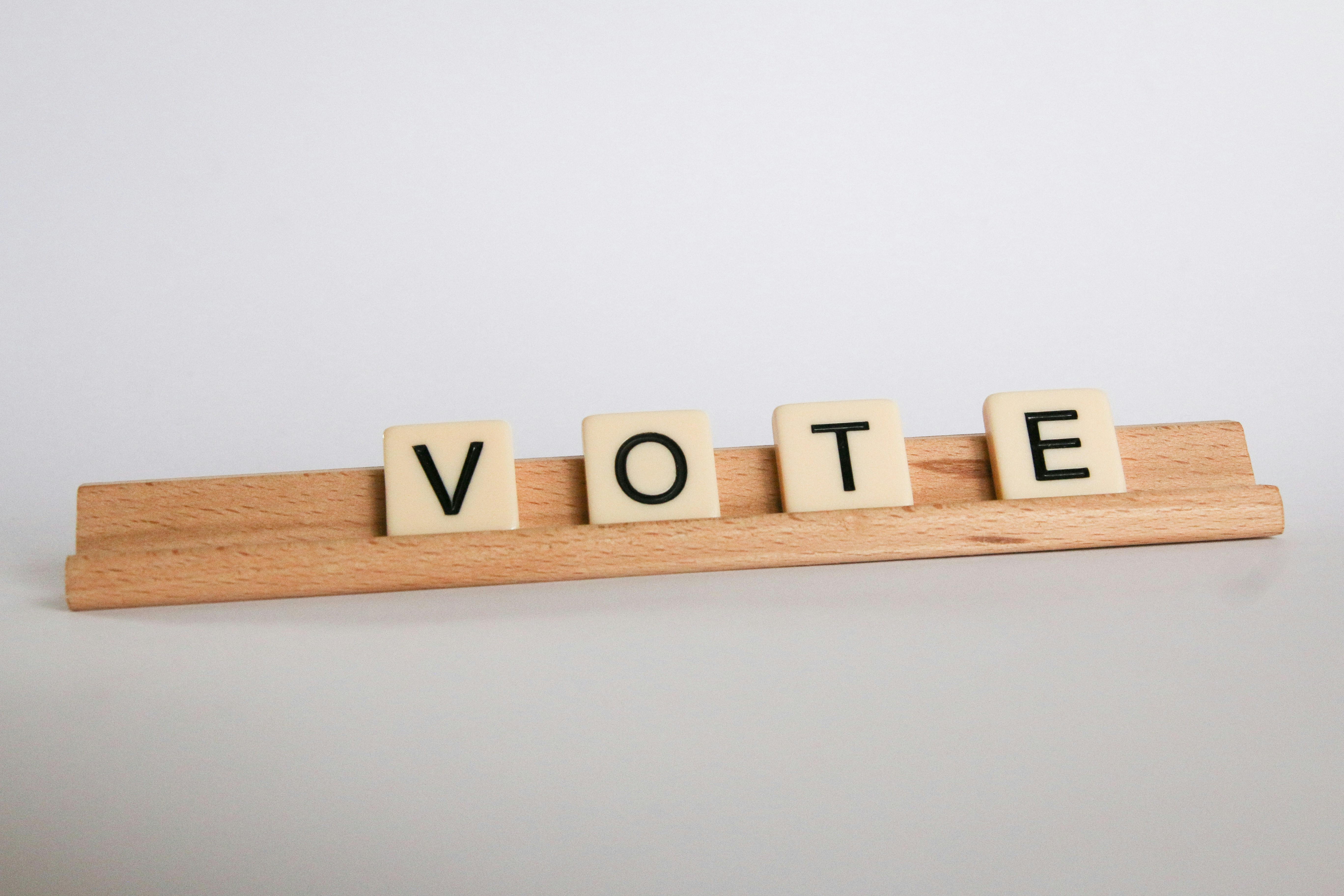 wooden tiles spelling out "vote"