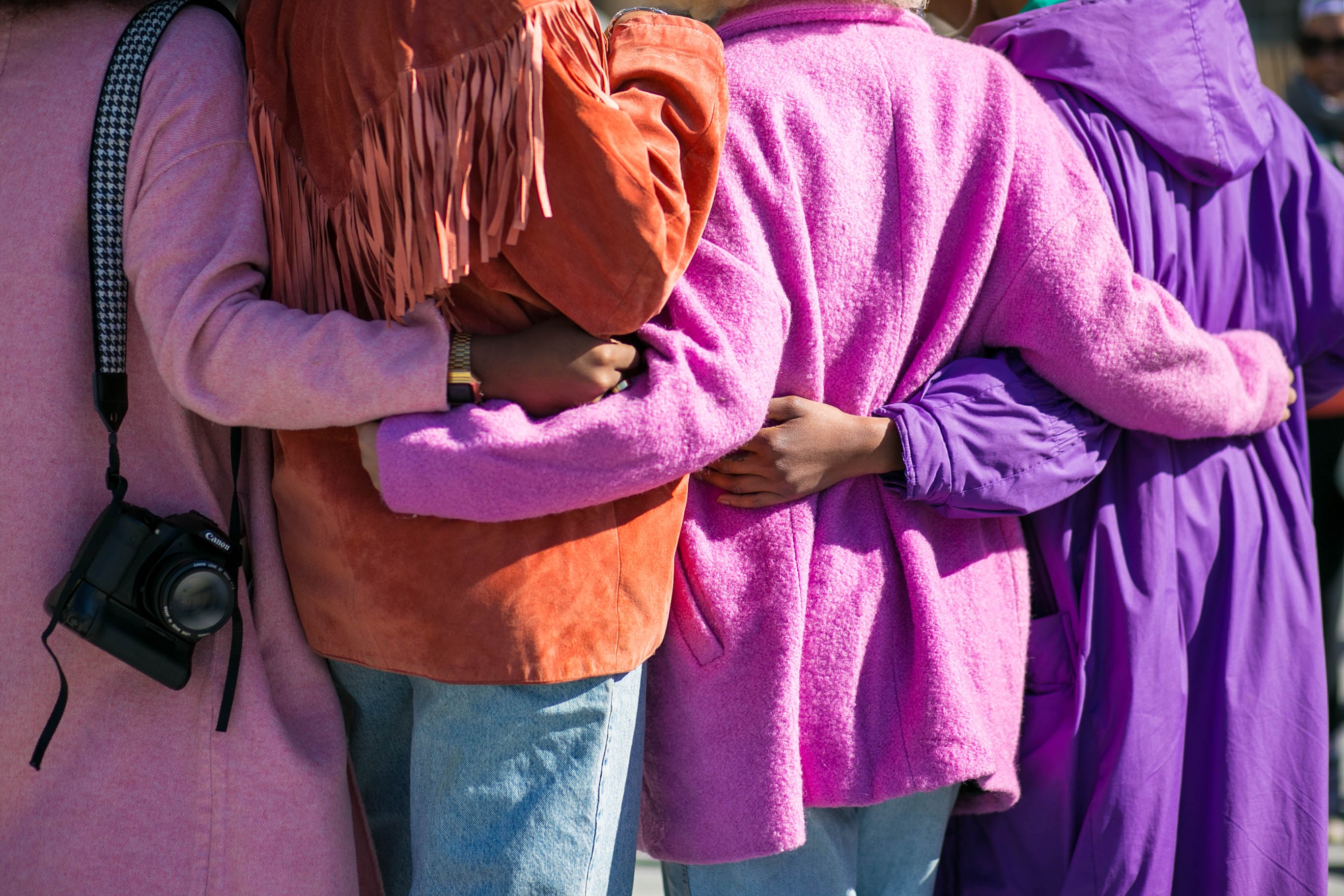 four people standing together