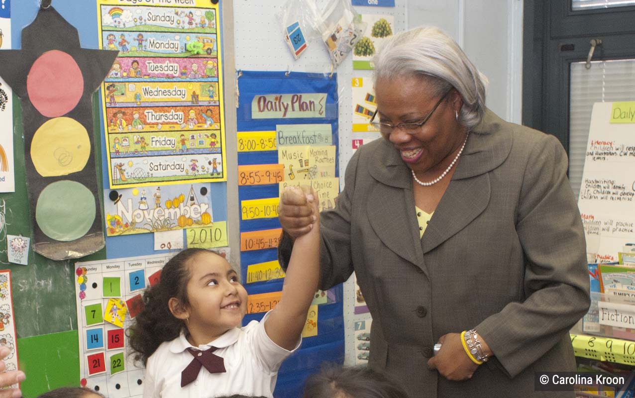 Principal Roberta Davenport at a 4Rs school with student